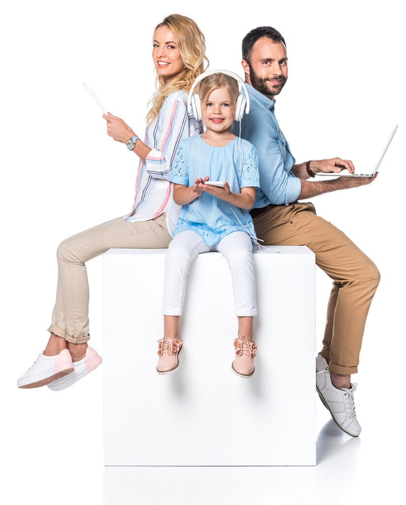 family using digital gadgets and sitting on white cube isolated